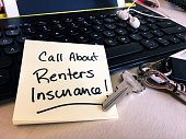 Note on desk keyboard to call about renters insurance