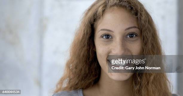 headshot of happy, mixed race teenager. - freckle girl stock pictures, royalty-free photos & images