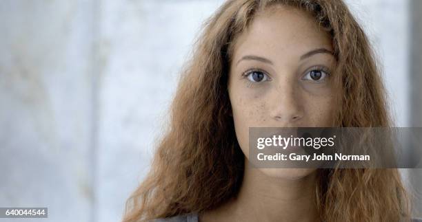 headshot of female, mixed race teenager. - freckle girl stock pictures, royalty-free photos & images