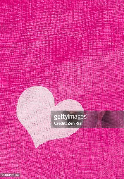 a pink heart embroidered on fabric - valentines day - embroidery heart stock pictures, royalty-free photos & images