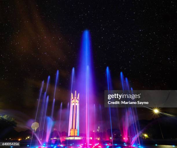 illuminated fountain in park at night - quezon city stock pictures, royalty-free photos & images