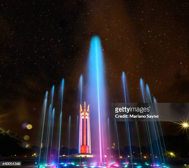 illuminated fountain in park at night - quezon city stock pictures, royalty-free photos & images