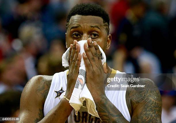 Terrence Jones of the New Orleans Pelicans wipes his face during the second half of a game against the Cleveland Cavaliers at the Smoothie King...