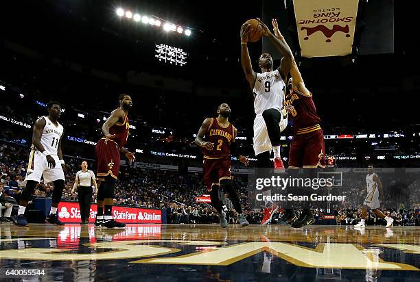 Terrence Jones of the New Orleans Pelicans shoots over Kevin Love of the Cleveland Cavaliers druing a game at the Smoothie King Center on January 23,...