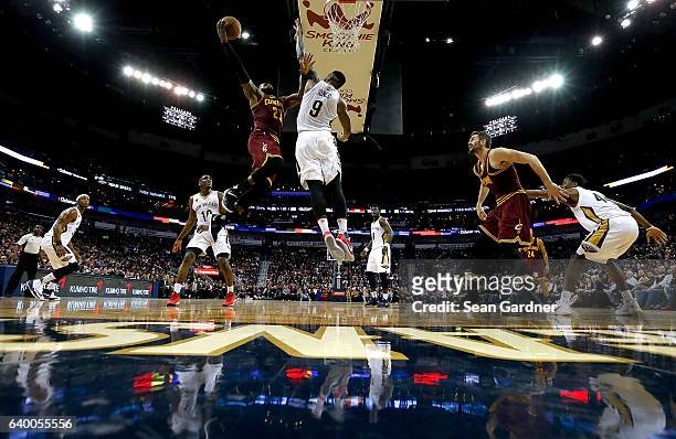 LeBron James of the Cleveland Cavaliers shoots over Terrence Jones of the New Orleans Pelicans during a game at the Smoothie King Center on January...