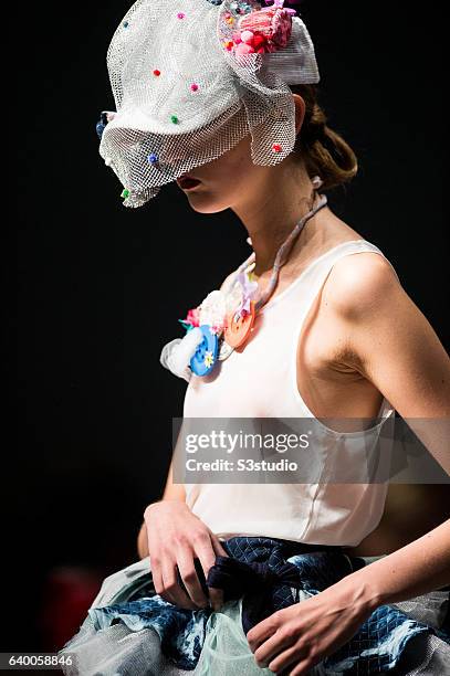 Model showcases designs by Steffi Chan during the Day 2 of the Hong Kong Fashion Week for Spring / Summer 2014 at the Hong Kong Convention and...