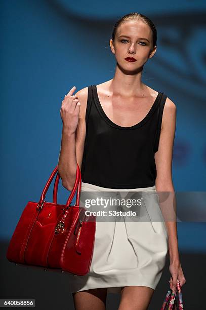 Model showcases designs by Steffi Chan during the Day 2 of the Hong Kong Fashion Week for Spring / Summer 2014 at the Hong Kong Convention and...