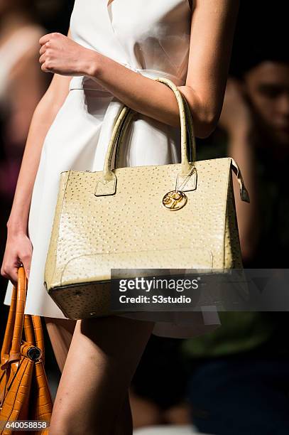 Model showcases designs by Steffi Chan during the Day 2 of the Hong Kong Fashion Week for Spring / Summer 2014 at the Hong Kong Convention and...
