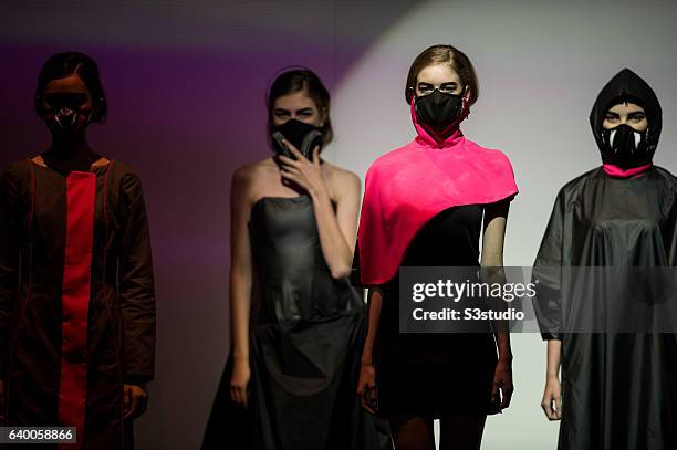 Model showcases designs by Nina Griffee during the Day 2 of the Hong Kong Fashion Week for Spring / Summer 2014 at the Hong Kong Convention and...