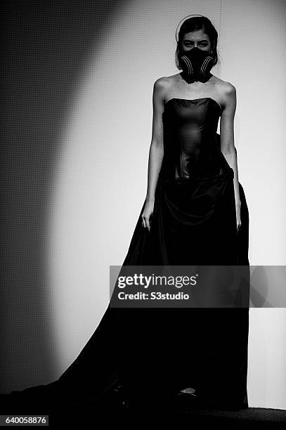 Model showcases designs by Nina Griffee during the Day 2 of the Hong Kong Fashion Week for Spring / Summer 2014 at the Hong Kong Convention and...