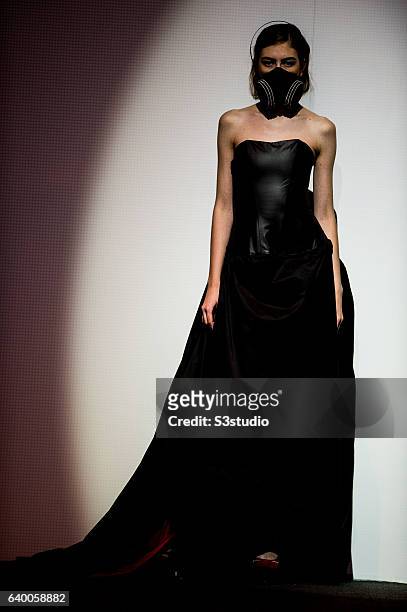 Model showcases designs by Nina Griffee during the Day 2 of the Hong Kong Fashion Week for Spring / Summer 2014 at the Hong Kong Convention and...