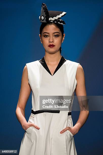 Model showcases designs by xxx during the Day 2 of the Hong Kong Fashion Week for Spring / Summer 2014 at the Hong Kong Convention and Exhibition...