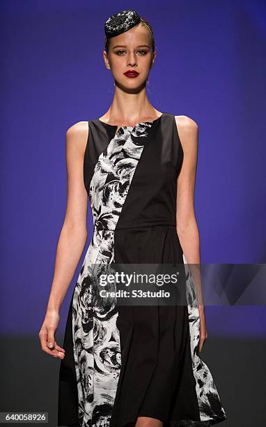 Model showcases designs by xxx during the Day 2 of the Hong Kong Fashion Week for Spring / Summer 2014 at the Hong Kong Convention and Exhibition...