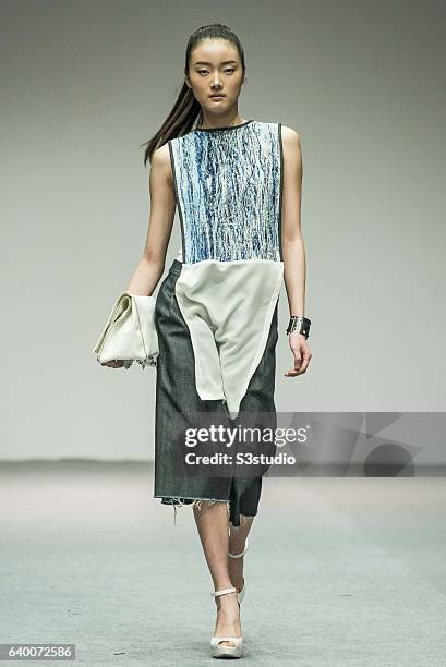 Models showcase Alex Law designs on the runway during the The EcoChic Design Award 2013 by Redress as part of the Hong Kong Fall/Winter Fashion Week...