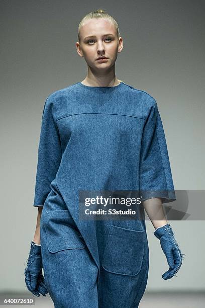 Models showcase Alex Law designs on the runway during the The EcoChic Design Award 2013 by Redress as part of the Hong Kong Fall/Winter Fashion Week...