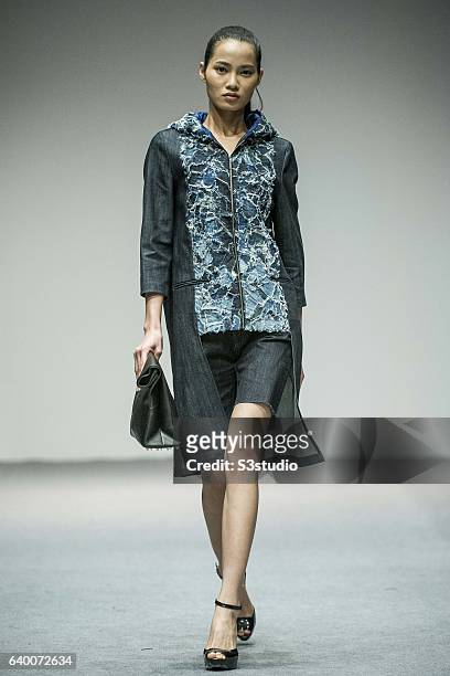 Models showcase Alex Law designs on the runway during the The EcoChic Design Award 2013 by Redress as part of the Hong Kong Fall/Winter Fashion Week...