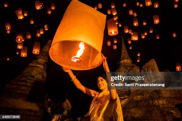 asia woman  floating lamp - yi peng stock pictures, royalty-free photos & images