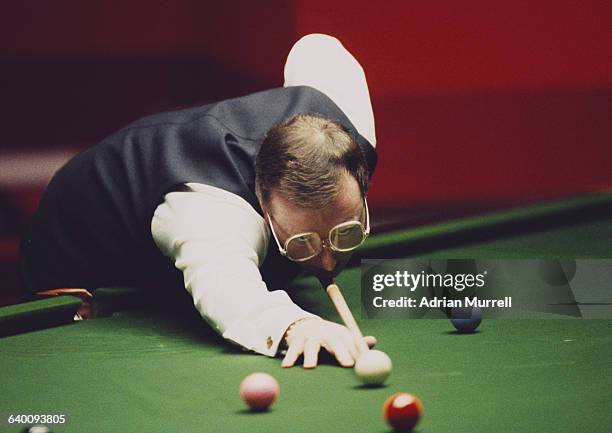 Dennis Taylor of Northern Ireland lines up the cue ball during his World Snooker Championship final match against Steve Davis on 28 April 1985 at the...