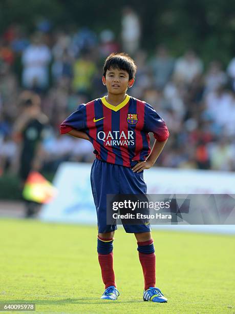 Takefusa Kubo of FC Barcelona in action during the U-12 Junior Soccer World Challenge 2013 final match between FC Barcelona and Liverpool FC at...