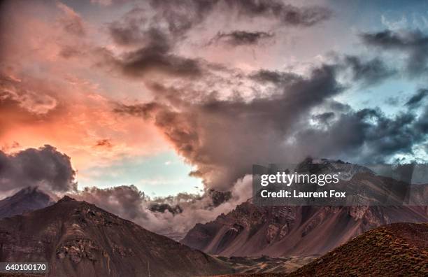 a beautiful sunset just before a snowstorm in the mountains of aconcagua national park, argentina. - mount aconcagua stock pictures, royalty-free photos & images