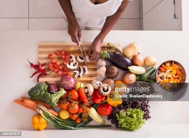 unrecognized women preparing fresh healthy salad. - wooden board　food stock pictures, royalty-free photos & images
