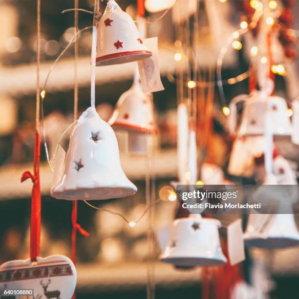 hanging christmas bells - christmas bells stock pictures, royalty-free photos & images