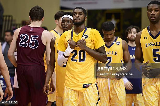 Johnson of the La Salle Explorers reacts with teammates Cleon Roberts , Amar Stukes and Tony Washington against the Pennsylvania Quakers after the...