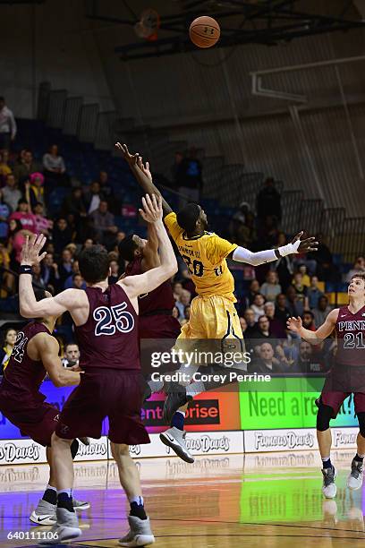 Johnson of the La Salle Explorers can't grab a high lob in a last seconds effort to tie or win against AJ Brodeur of the Pennsylvania Quakers during...