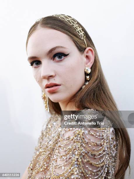 Model Adrienne Jueliger poses Backstage prior the Elie Saab Fashion Week on January 25, 2017 in Paris, France.