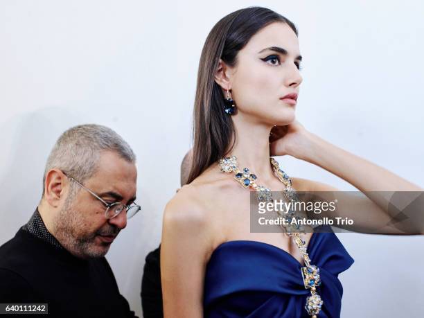 Model poses with the designer Elie Saab at Backstage prior the Elie Saab Fashion Week on January 25, 2017 in Paris, France.