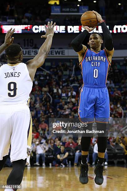 Russell Westbrook of the Oklahoma City Thunder shoots over Terrence Jones of the New Orleans Pelicans during the second half of a game at the...