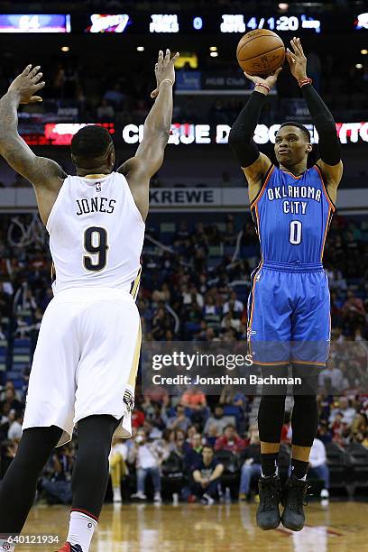 Russell Westbrook of the Oklahoma City Thunder shoots over Terrence Jones of the New Orleans Pelicans during the second half of a game at the...