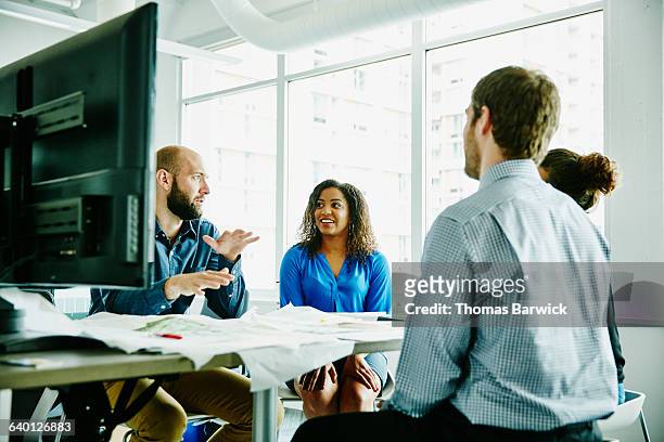 businessman leading discussion during meeting - group people thinking stock pictures, royalty-free photos & images