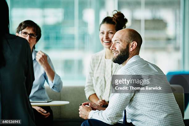 businessman in discussion with colleagues - business relationship stock pictures, royalty-free photos & images