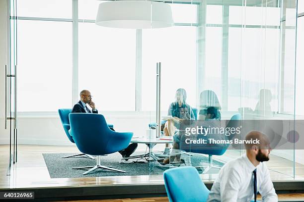 business executive listening during meeting - focus on background stock pictures, royalty-free photos & images