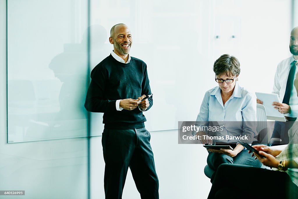 Laughing mature businessman in meeting