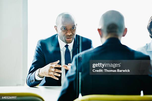 businessman leading discussion during meeting - skjorta och slips bildbanksfoton och bilder