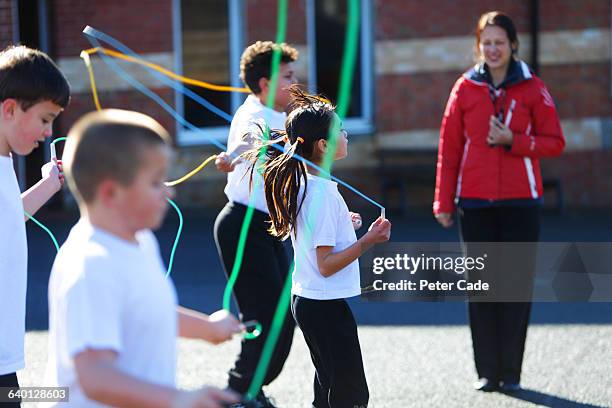 children skipping in playground - physical education stock pictures, royalty-free photos & images