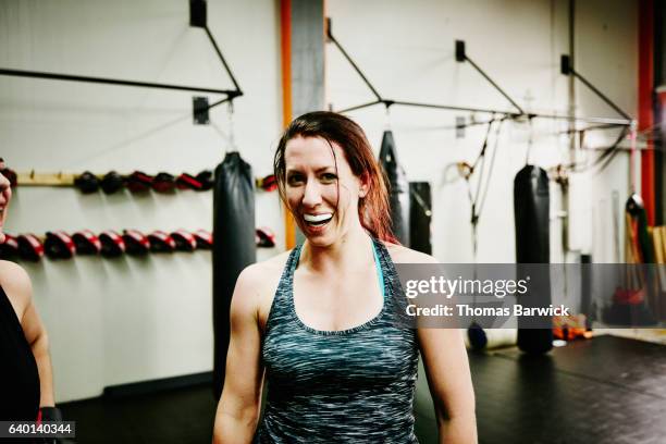 portrait of female fighter with mouthguard working out in gym - funny boxing bildbanksfoton och bilder