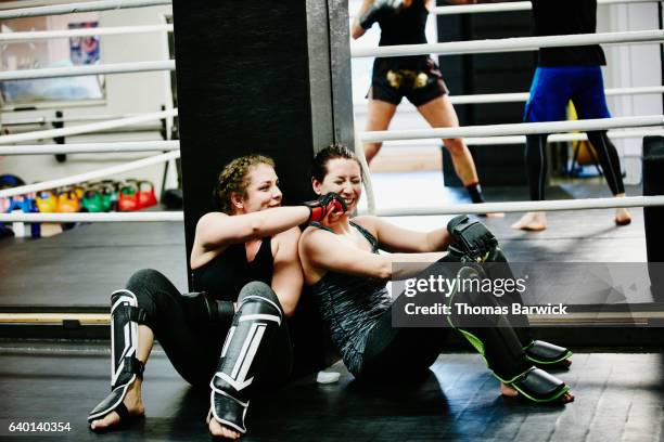 laughing female fighters resting during workout in training gym - funny boxing bildbanksfoton och bilder