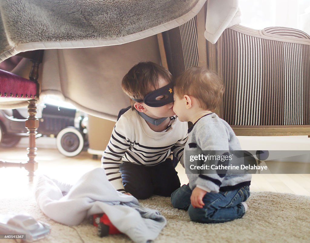 2 brothers playing at home