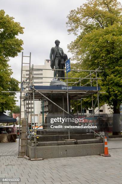 male statue in front of the christchurch cathedral - christchurch earthquake stock pictures, royalty-free photos & images