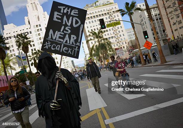 Participant holds a 'Calexit' sign during the Women's March on January 21, 2017 in Los Angeles, California. Tens of thousands of people took to the...