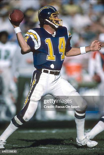 Dan Fouts of the San Diego Chargers drops back to pass against the Philadelphia Eagles during an NFL football game December 15, 1985 at Jack Murphy...