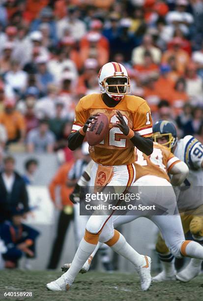 Quarterback Doug Williams of the Tampa Bay Buccaneers drops back to pass against the San Diego Charger during an NFL football game December 13, 1981...