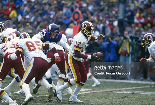 Washington, D.C. Doug Williams of the Washington Redskins turns to handoff to a running back against the Minnesota Vikings during the NFC...