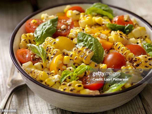 grilled corn salad with tomatoes and basil - corn salad stock pictures, royalty-free photos & images