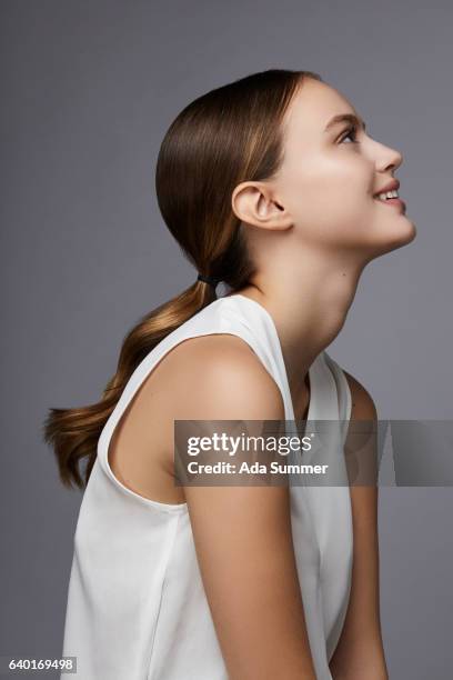 studio shot beautiful smiling woman - chignon stock pictures, royalty-free photos & images