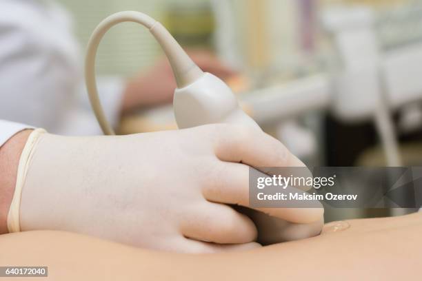 Doctor Performing Ultrasound Test On A Patient High-Res Stock Photo