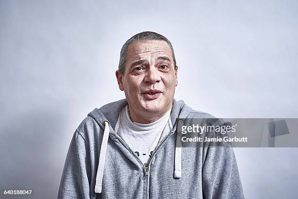 mid 40's british male talking to camera happily - man talking to camera stock pictures, royalty-free photos & images